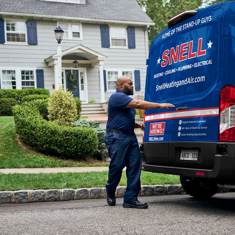 A Snell technician arrives at a home ready to provide expert HVAC, plumbing, and electrical services.