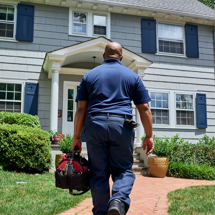 A Snell technician arrives at a home ready to provide expert HVAC, plumbing, and electrical services.