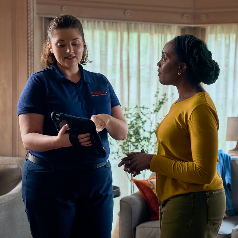 A Snell Comfort Advisor discuss our Comfort360 Membership benefits with a homeowner.