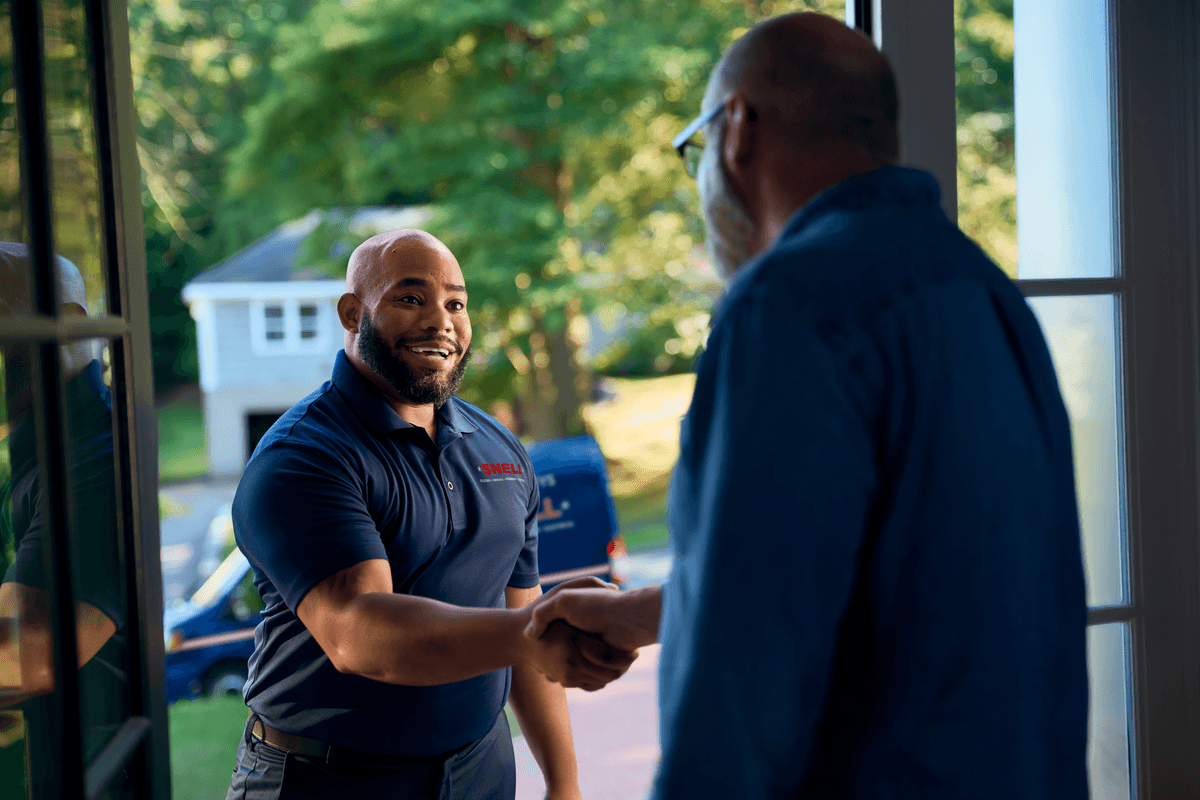 Technician shaking customers hand