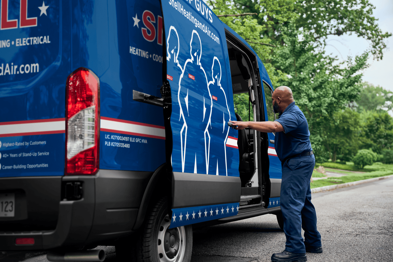 A professional Snell technician opening a service van on a residential street, ready to provide home HVAC, plumbing, and electrical services.